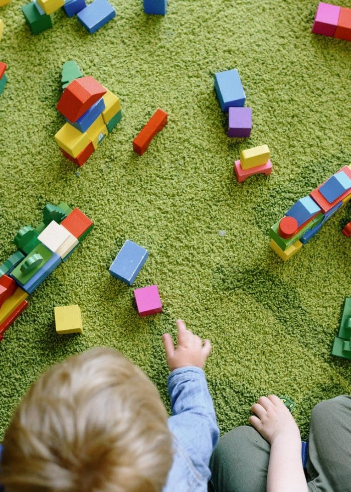 canva-children-playing-with-colorful-wooden-blocks-MAEiwSG9okg